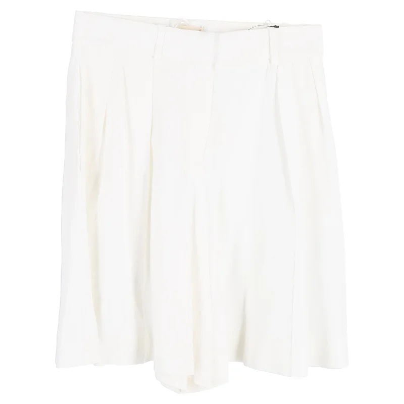 Khaite Isabelle Pleated High-Rise Shorts in White Acetate